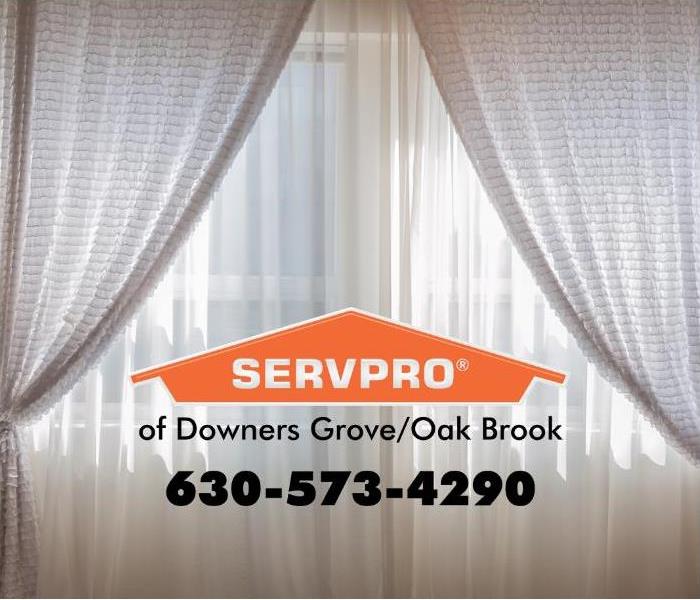 White drapes with a SERVPRO logo in the middle.